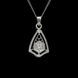 a diamond pendant on a black background
