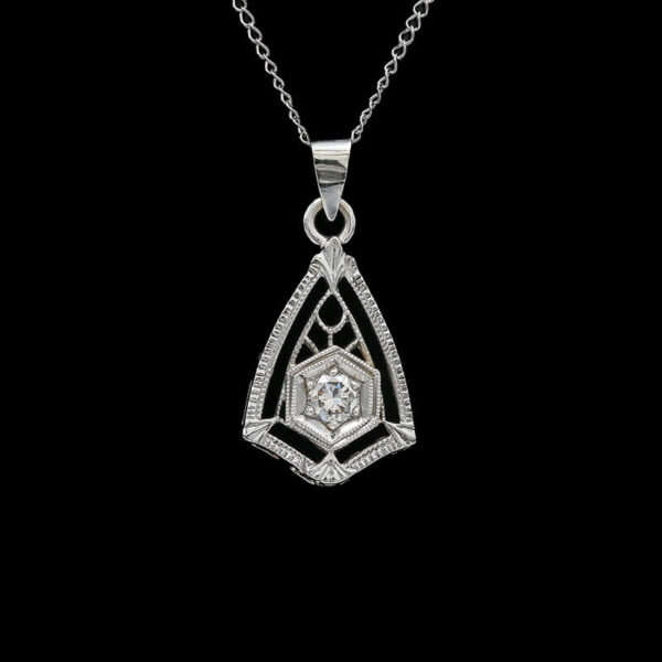a diamond pendant on a black background
