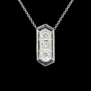an art deco necklace with diamonds on a chain
