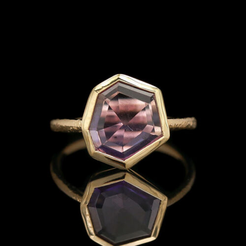 a ring with an amethorate stone in the center