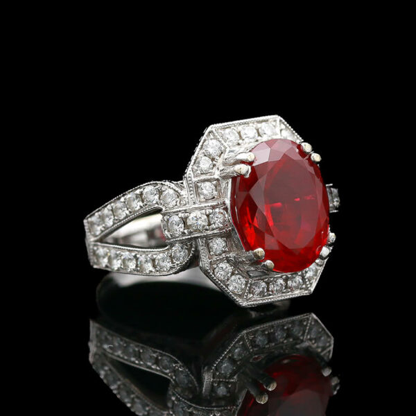 an oval shaped ruby and diamond ring