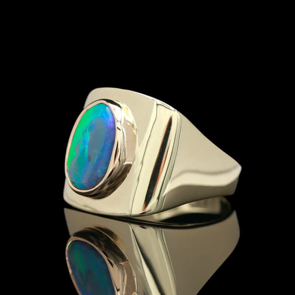 a silver ring with an opal in the center
