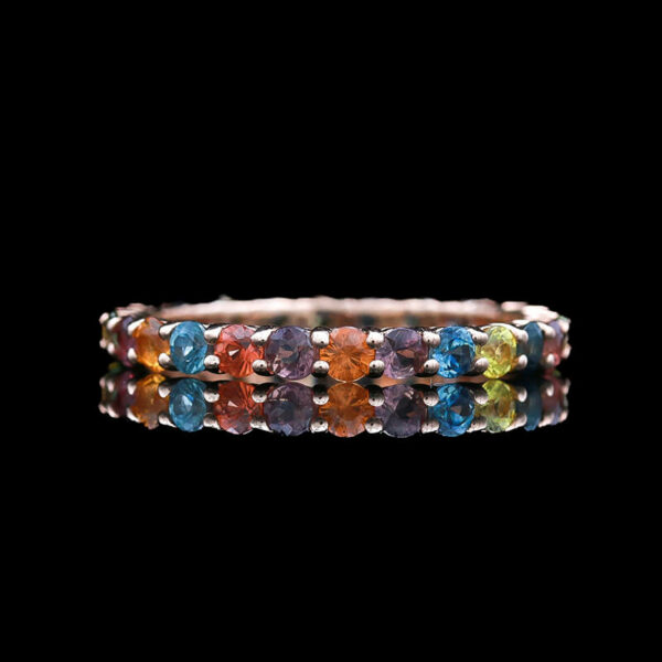 a ring with multi colored stones on it