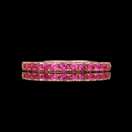 a pink and yellow gold ring with diamonds