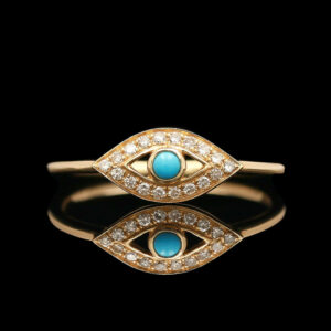 a gold ring with an evil eye and diamonds