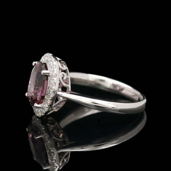 an oval shaped pink tourmaline and diamond ring