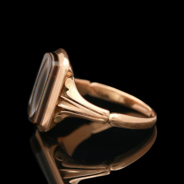 a gold ring with a stone on it