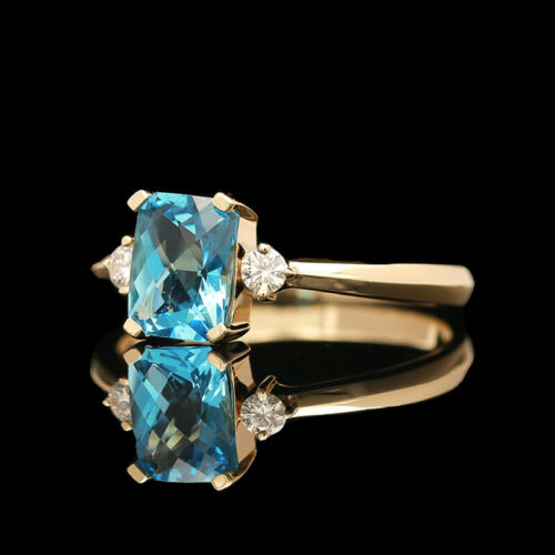 a blue ring with two diamonds on it