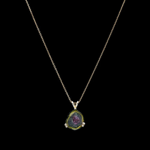 a necklace with a green and purple stone