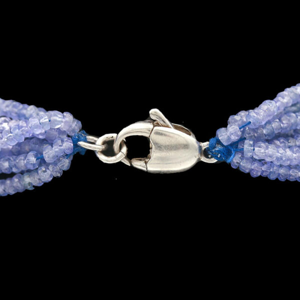a bracelet with blue beads and a silver clasp