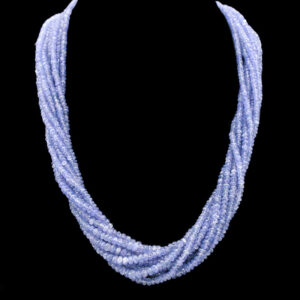 a blue necklace on a black background