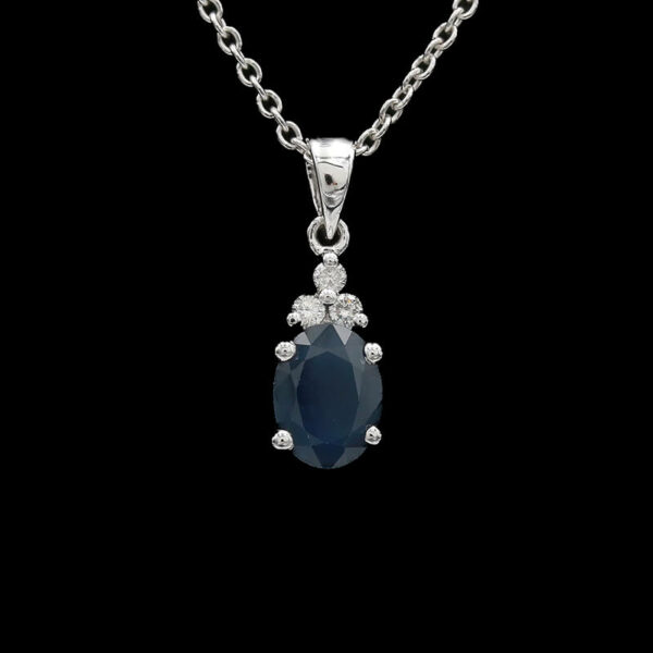 a necklace with a large blue stone on it