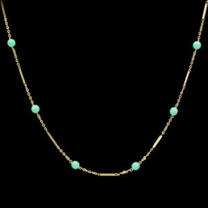 a gold chain with turquoise beads on it