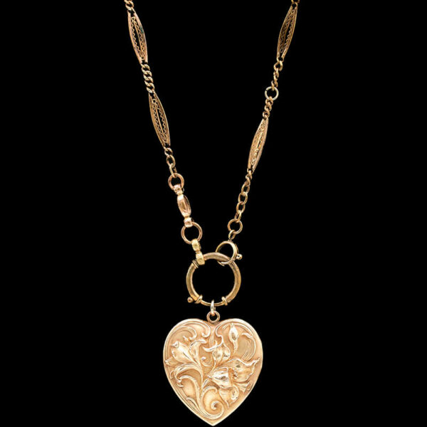 a heart shaped pendant with a chain attached to it