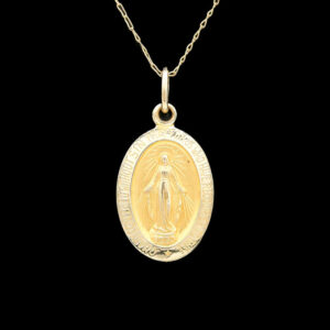 a gold necklace with an image of the virgin mary