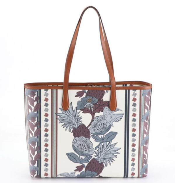 a white and brown floral print bag on a white background