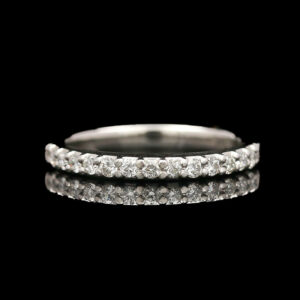a wedding ring with three rows of diamonds