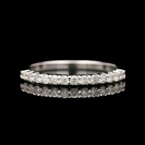 a wedding band with three rows of diamonds