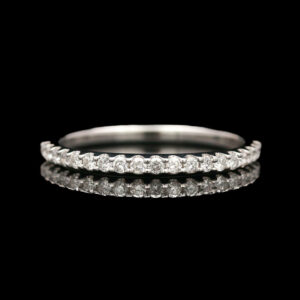 a wedding ring with three rows of diamonds