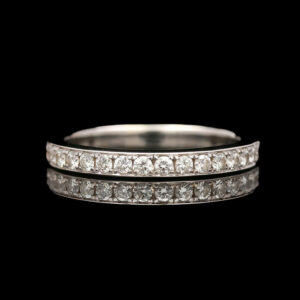 a wedding ring with two rows of diamonds