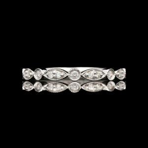 a white gold wedding band with three pear shaped diamonds