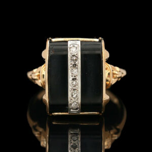 a black and white ring with diamonds on it