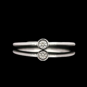 a close up of two rings on a black background