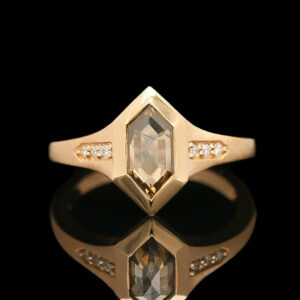 a yellow gold ring with an octagonal cut diamond