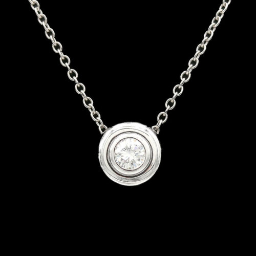 a white gold necklace with a diamond