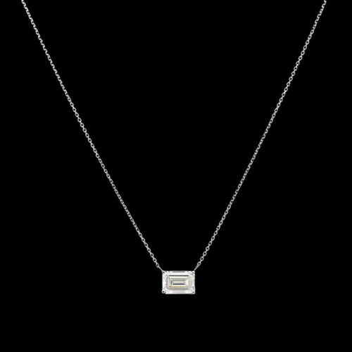 a necklace with a square pendant on a black background