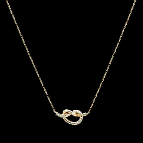 a gold necklace with two intertwined links
