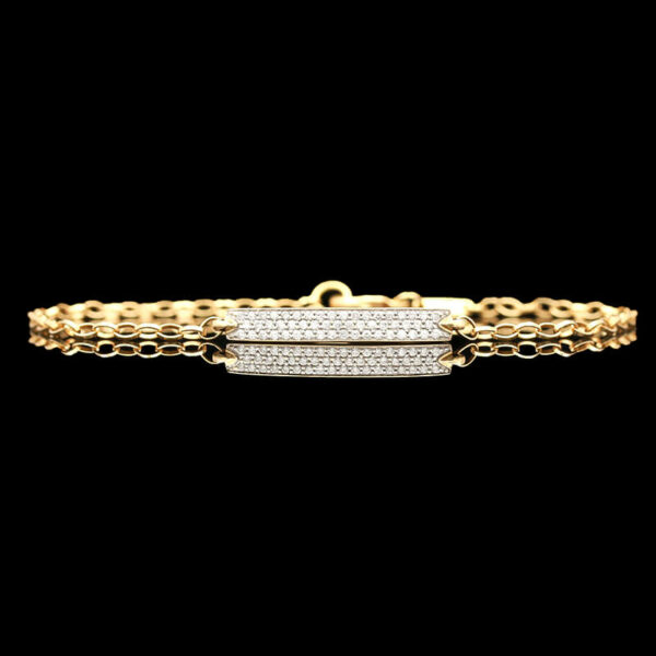a gold bracelet with two rows of diamonds