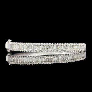 a pair of white gold and diamond bracelets