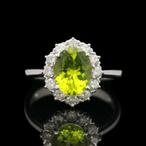 a yellow diamond ring with white diamonds around it