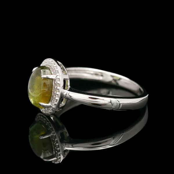 a ring with a yellow stone and diamonds