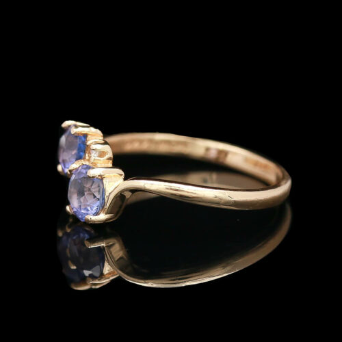 an antique ring with two blue sapphire stones