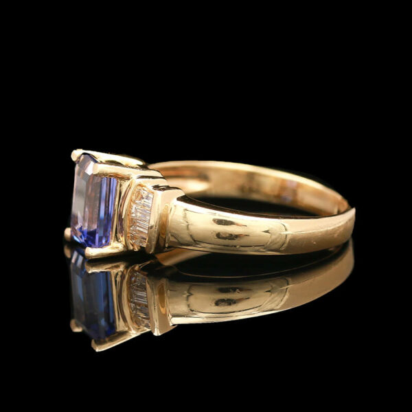 a fancy ring with a blue stone in the center