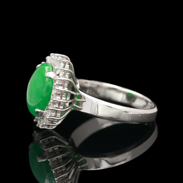 an oval shaped green jade and diamond ring