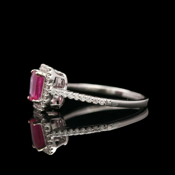 an engagement ring with two pink stones and diamonds