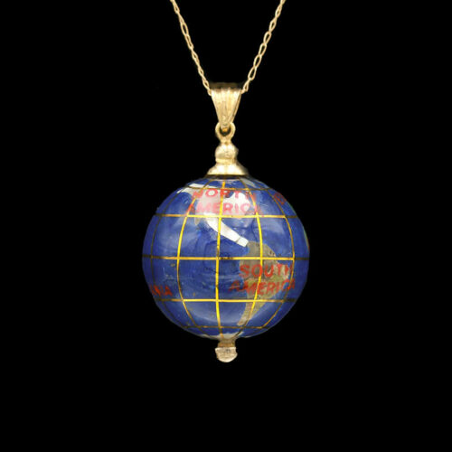 a blue and yellow globe pendant on a gold chain