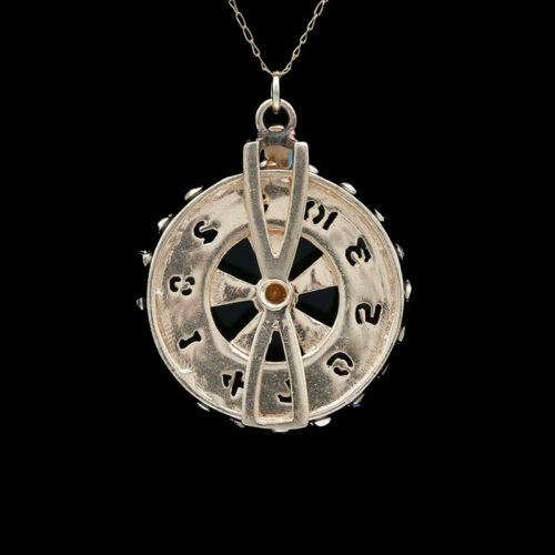 a necklace with a compass on it