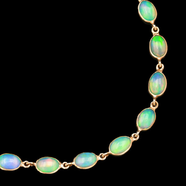 an opalite necklace with gold chains