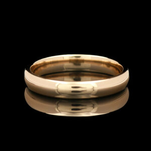 a gold wedding band with bamboo inlays