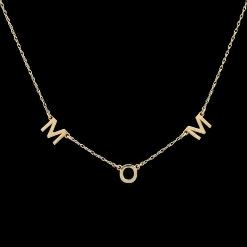 a gold necklace with the letter m on it
