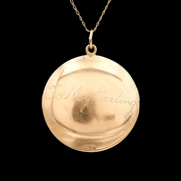 a gold locke necklace with the words,'i love my wedding'written on it