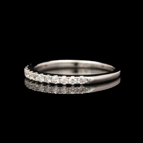 a wedding ring with three diamonds on it