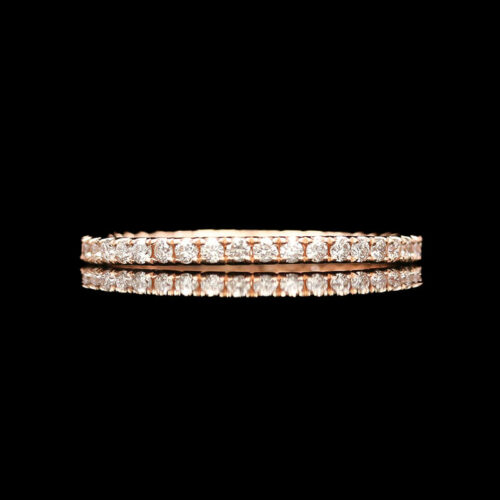 a diamond ring set in 18k rose gold