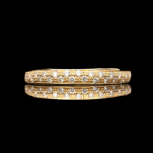 a yellow gold and diamond ring