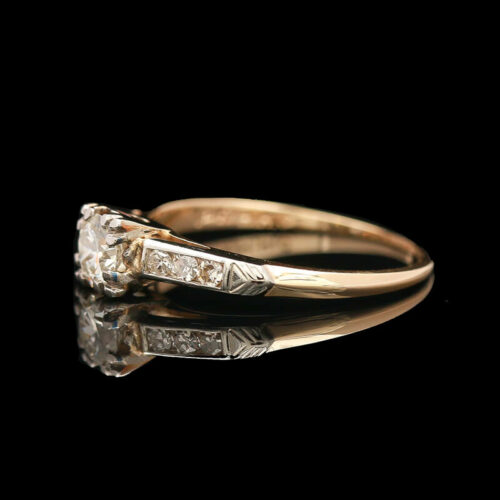 an antique diamond ring with three diamonds on it