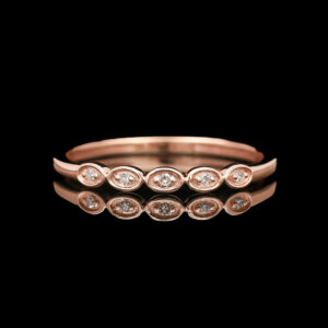 a rose gold ring with diamonds on it